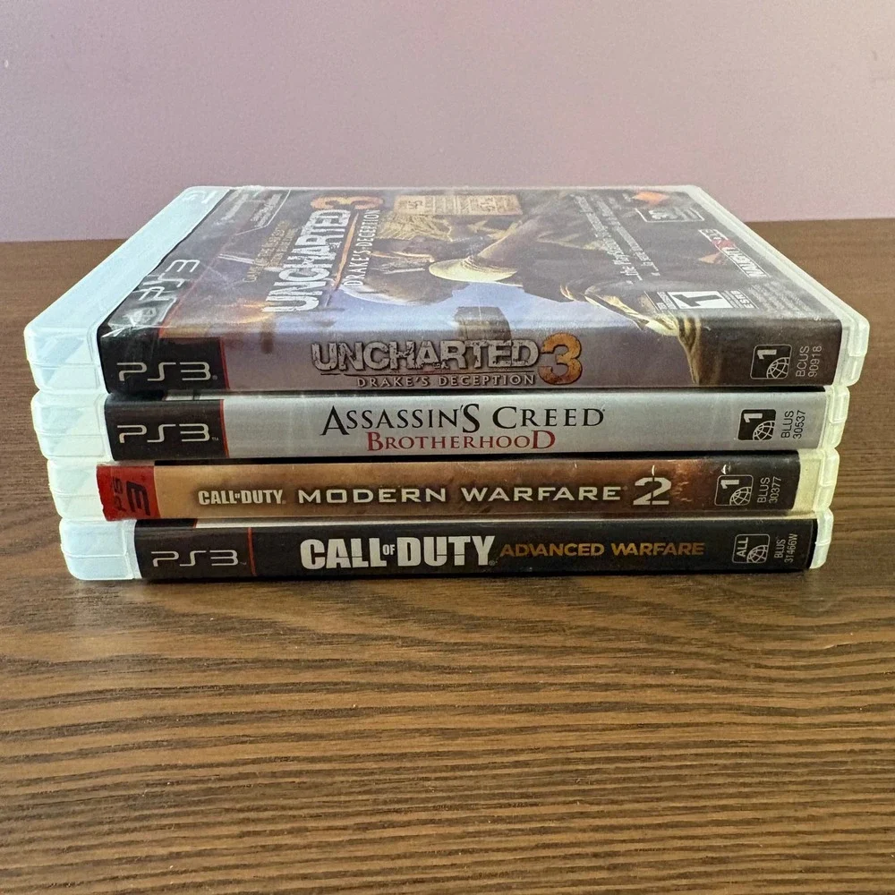 Sony PlayStation 3 PS3 Video Game Bundle 4 Games Good COD‎ Uncharted AC Lot